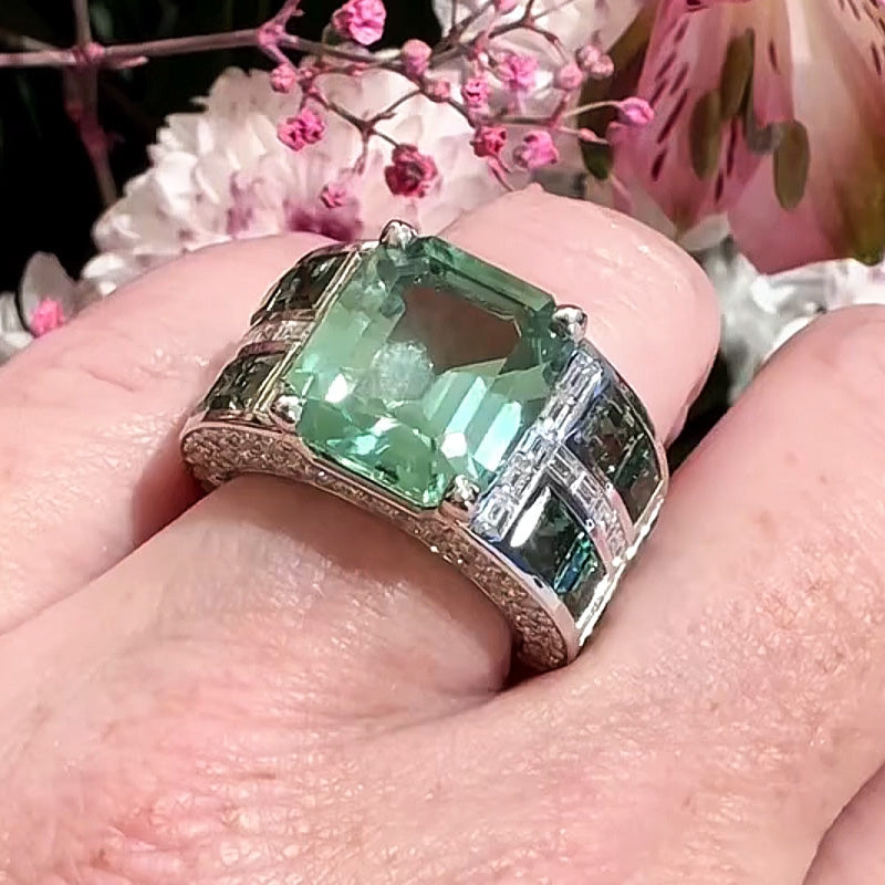 7.86ctw emerald cut green tourmaline and sapphire engagement ring