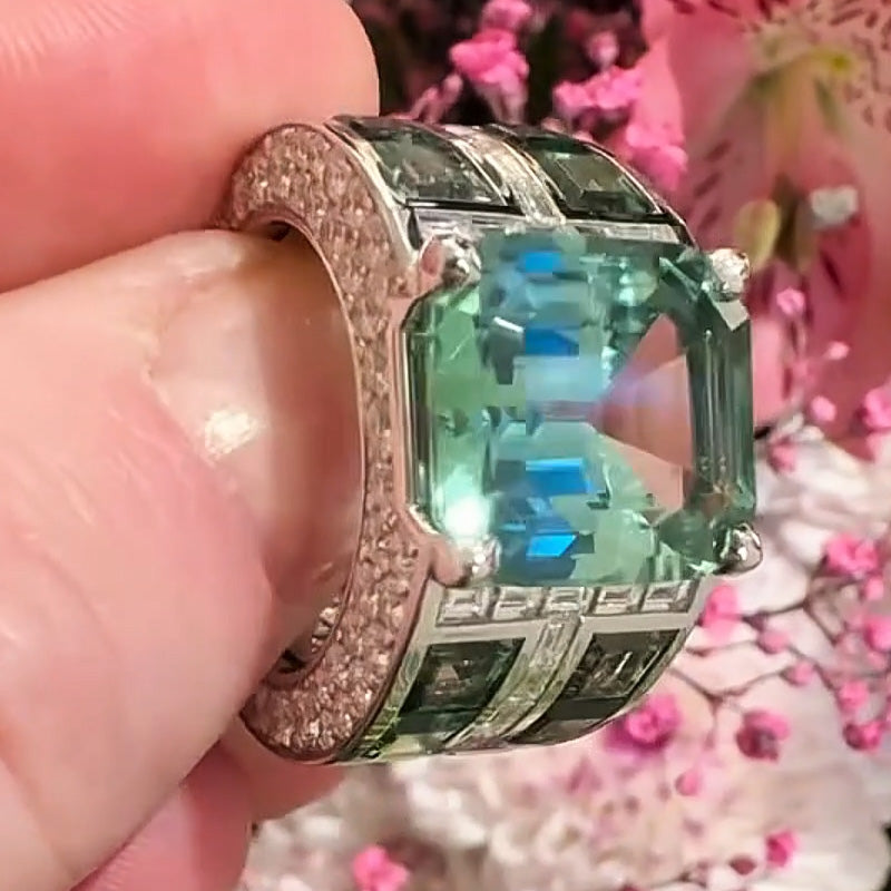 7.86ctw emerald cut green tourmaline and sapphire engagement ring