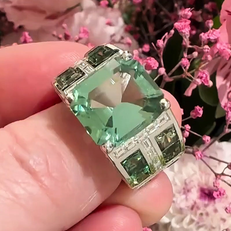 7.86ctw emerald cut green tourmaline and sapphire engagement ring