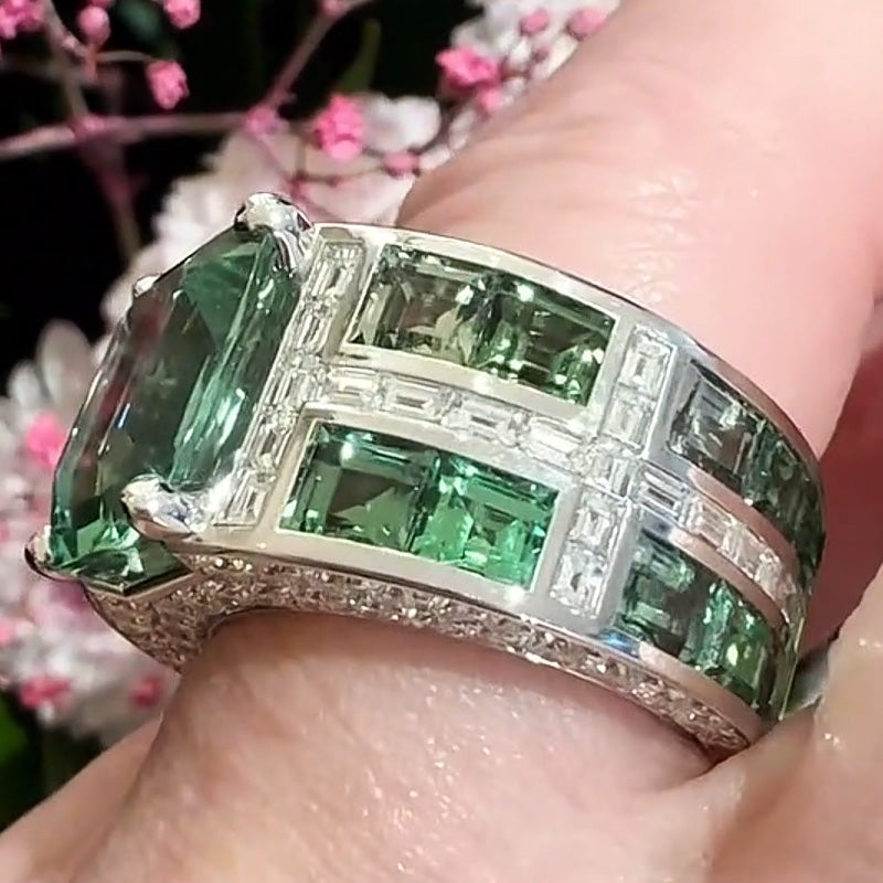 7.86ctw emerald cut green tourmaline and sapphire engagement ring