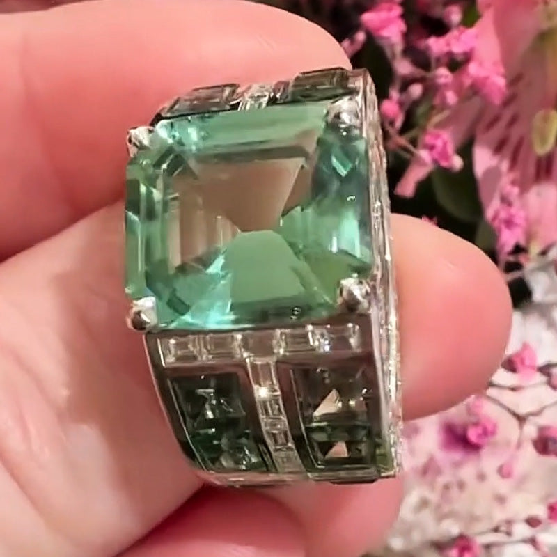 7.86ctw emerald cut green tourmaline and sapphire engagement ring