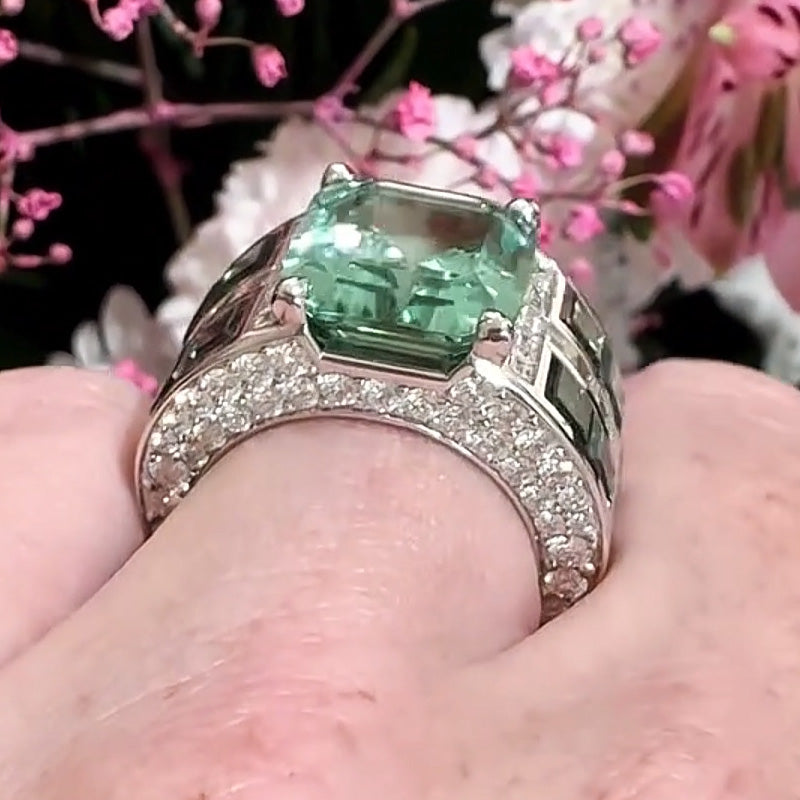 7.86ctw emerald cut green tourmaline and sapphire engagement ring