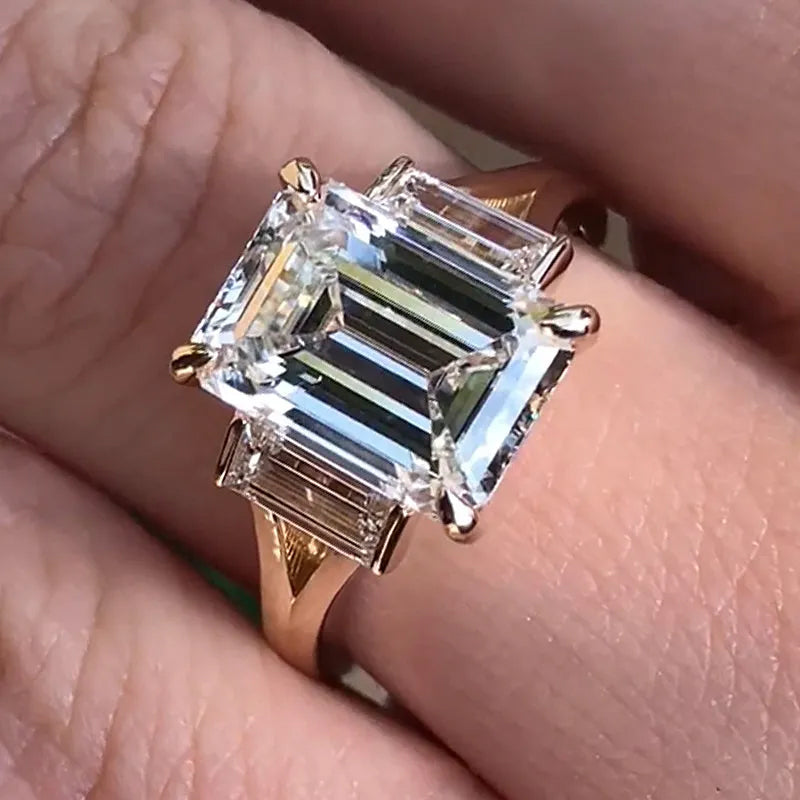 4.5ct split shank three stone emerald cut engagement ring