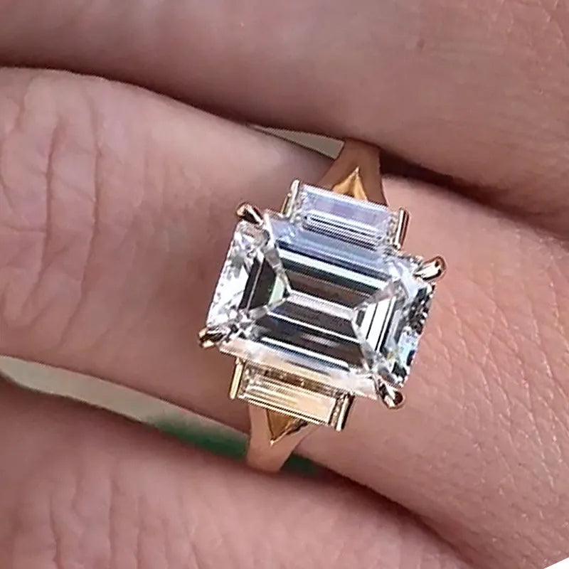 4.5ct split shank three stone emerald cut engagement ring