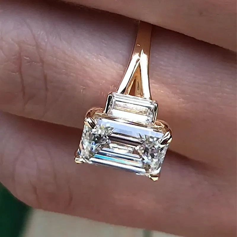 4.5ct split shank three stone emerald cut engagement ring