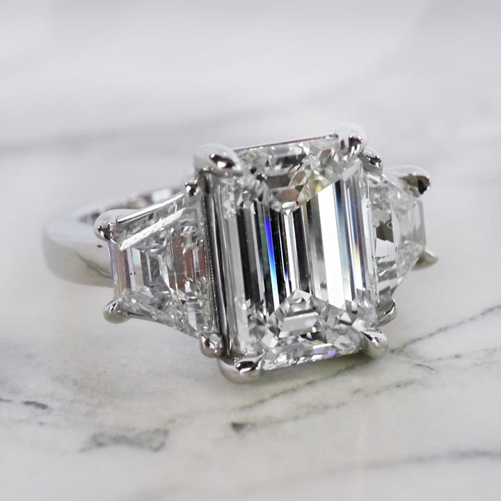 4.5ct Emerald Cut Stepped Three Stone Engagement Ring