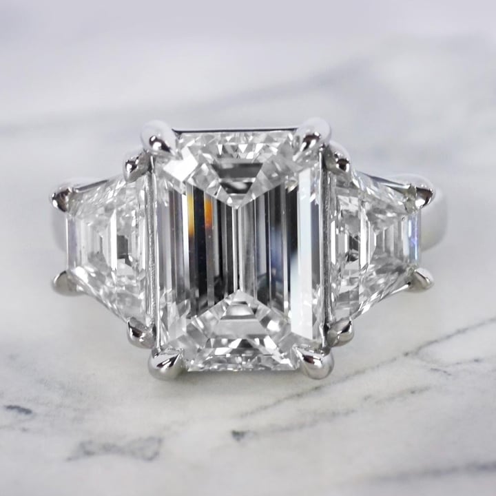 4.5ct Emerald Cut Stepped Three Stone Engagement Ring