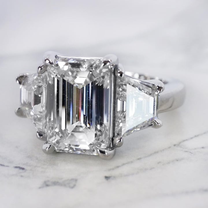 4.5ct Emerald Cut Stepped Three Stone Engagement Ring